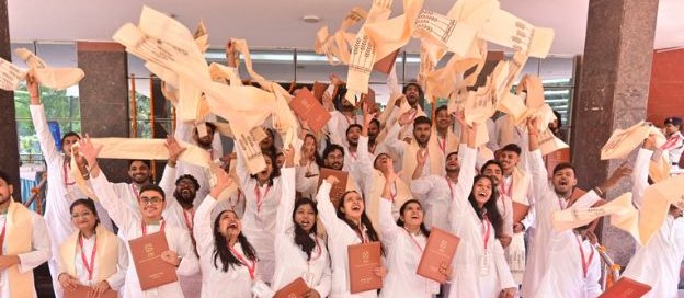 PDM-11 graduates throwing their stoles in the air at DMI's Annual Convocation 2026